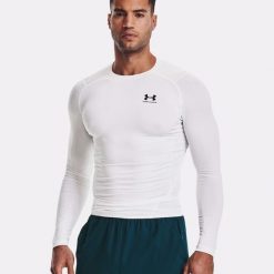 Koszulka termoaktywna męska UNDER ARMOUR 1361524 z długim rękawem. Białe bluzy męskie Under Armour, m, bez wzorów, sportowe, bez ramiączek, bez kaptura. Za 222.50 zł.