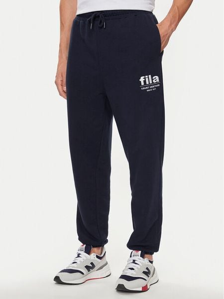 Fila Spodnie dresowe FAM0647 Granatowy Regular Fit. Niebieskie spodnie sportowe męskie Fila, m, bez wzorów, z bawełny. Za 139.99 zł.