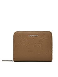 Calvin Klein Portfel Ck Must Md Zip Around_Caviar K60K612831 Beżowy. Brązowe portfele damskie Calvin Klein, ze skóry. Za 159.99 zł.