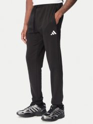 Adidas Spodnie dresowe Essentials Feelcozy JE3815 Czarny Regular Fit. Czarne spodnie sportowe męskie Adidas, m, bez wzorów, z dresówki. Za 219.99 zł.