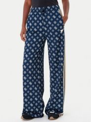 Guess Spodnie dresowe V5YB10 K0282 Granatowy Relaxed Fit. Niebieskie spodnie dresowe damskie Guess, z aplikacjami, z dresówki. Za 329.99 zł.