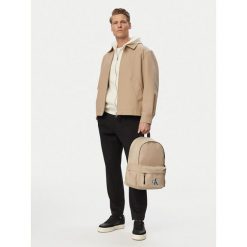 Plecak Calvin Klein Jeans. Brązowe plecaki męskie Calvin Klein Jeans, bez wzorów, z jeansu, sportowe. Za 349.99 zł.