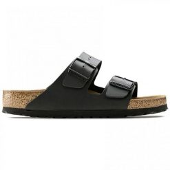Klapki Birkenstock Arizona Nero Dorosłych. Brązowe klapki damskie Birkenstock, bez wzorów, ze skóry, bez zapięcia. Za 380.66 zł.