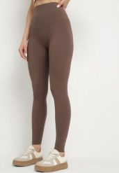 Brązowe Klasyczne Legginsy z Wysokim Stanem Melio. Brązowe legginsy damskie Born2be, bez wzorów, z jeansu. Za 44.99 zł.