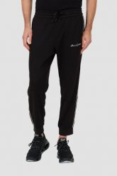 ARMANI EXCHANGE Czarne spodnie dresowe. Czarne spodnie sportowe męskie Armani Exchange, l, bez wzorów, z dresówki. W wyprzedaży za 441.99 zł.