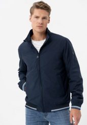 Lekka kurtka ze stójką J-TAWNY. Niebieskie kurtki męskie Volcano, l, bez wzorów, z materiału, eleganckie, bez kaptura. Za 329.99 zł.