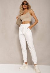 Białe Dresowe Spodnie High Waist z Błyszczącym Sznurkiem w Pasie Darciasa. Białe spodnie dresowe damskie Renee, bez wzorów, z dresówki, z podwyższonym stanem. Za 29.99 zł.
