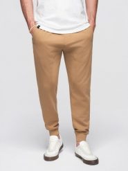 Spodnie męskie dresowe typu jogger - brązowe V2 - Rozmiar: S. Brązowe spodnie sportowe męskie Ombre Clothing, m, bez wzorów, z bawełny. W wyprzedaży za 101.24 zł.