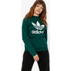 Adidas Bluza Trf Crew Sweat Adicolor , zielony, rozmiar L. Zielone bluzy damskie Adidas, l, bez wzorów, z bawełny, klasyczne, bez ramiączek, bez kaptura. W wyprzedaży za 169.99 zł.