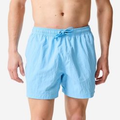 Spodenki surfingowe męskie Decathlon 100 Pomięte 15". Niebieskie szorty męskie Decathlon, bez wzorów, z materiału, sportowe. Za 69.99 zł.