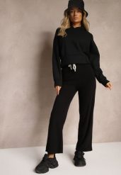 Czarne Spodnie z Dodatkiem Wiskozy High Waist o Szerokim Kroju ze Sznurkami Isnia. Czarne spodnie materiałowe damskie Renee, bez wzorów, z jeansu, eleganckie, z podwyższonym stanem. Za 44.99 zł.