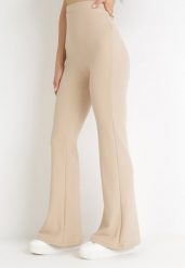 Beżowe Spodnie Dzwony z Gumką w Pasie Milica. Brązowe spodnie materiałowe damskie Born2be, bez wzorów, z jeansu, eleganckie, z podwyższonym stanem. Za 89.99 zł.