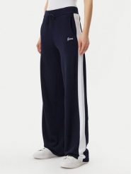 Guess Spodnie dresowe V5GB00 Z3D60 Granatowy Regular Fit. Niebieskie spodnie sportowe damskie Guess, z aplikacjami, z dresówki. Za 319.99 zł.