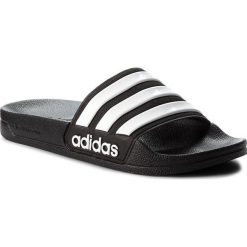 Klapki adidas - adilette Shower AQ1701 Cblack/Ftwwht/Cblack. Czarne klapki damskie Adidas, bez wzorów, z materiału, bez obcasa, bez zapięcia. Za 99.95 zł.
