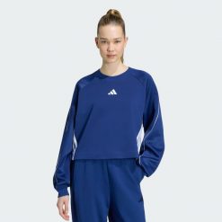 Bluza Stadium z zaokrąglonym dekoltem i 3 paskami. Niebieskie bluzy damskie Adidas, m, bez wzorów, z bawełny, sportowe, bez ramiączek, bez kaptura. Za 259.00 zł.