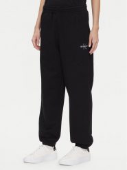 Calvin Klein Jeans Spodnie dresowe Monologo LV047B235G Czarny Regular Fit. Czarne spodnie dresowe damskie Calvin Klein Jeans, bez wzorów, z bawełny. Za 269.99 zł.