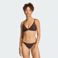 Prążkowana góra bikini Iconisea z wyjmowanymi wkładkami i trójkątnym krojem. Brązowe stroje kąpielowe damskie Adidas, bez wzorów, prążkowane. Za 179.00 zł.