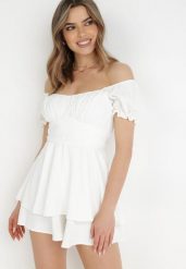 Biały Kombinezon Rhodosyne. Białe sukienki damskie Born2be, na imprezę, m, bez wzorów, eleganckie, bez kołnierzyka, bez ramiączek, mini. Za 109.99 zł.