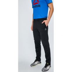 Reebok - Spodnie. Czarne spodnie sportowe męskie Reebok, m, bez wzorów, z dzianiny. W wyprzedaży za 169.90 zł.