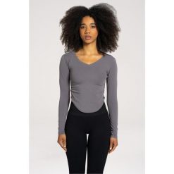 Koszulka fitness damska Gym Glamour wycięta z długimi rękawami. Szare bluzki damskie GYM GLAMOUR, s, bez wzorów, glamour, bez kołnierzyka, bez ramiączek. Za 149.99 zł.