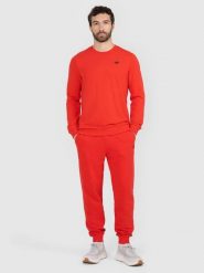 4F Spodnie dresowe joggery męskie - czerwone M. Czerwone spodnie materiałowe męskie 4F, bez wzorów, z bawełny. W wyprzedaży za 79.99 zł.