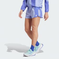 Szorty Own the Run Base AEROREADY. Niebieskie szorty damskie Adidas, bez wzorów, z materiału, sportowe. Za 170.20 zł.