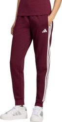 Adidas Spodnie damskie adidas Essentials 3-Stripes Fleece Slim bordowe KF8321 XL. Czerwone spodnie dresowe damskie Adidas, bez wzorów, sportowe. Za 236.51 zł.