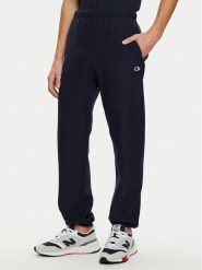 Champion Spodnie dresowe 220709 Granatowy Relaxed Fit. Niebieskie spodnie sportowe męskie Champion, m, bez wzorów, z bawełny. Za 239.99 zł.