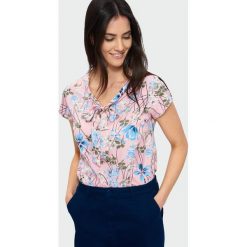 Elegancka bluzka z wiązanym dekoltem. Bluzki damskie Greenpoint, bez wzorów, z poliesteru, eleganckie, bez kołnierzyka, bez ramiączek. Za 24.99 zł.