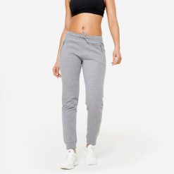 Spodnie dresowe damskie Domyos Gym & Pilates slim. Szare spodnie dresowe damskie DOMYOS, bez wzorów, z dresówki, sportowe. W wyprzedaży za 59.99 zł.