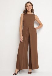 Brązowy Kombinezon Bez Rękawów z Szerokimi Nogawkami i Kieszeniami Veleldia. Brązowe sukienki damskie Born2be, m, bez wzorów, eleganckie, bez kołnierzyka, bez ramiączek. Za 149.99 zł.