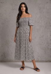 Czarna Sukienka Hiszpanka z Bawełny w Roślinny Print Podkreślająca Talię Kradli. Czarne sukienki damskie Renee, na co dzień, m, bez wzorów, z bawełny, boho, bez kołnierzyka, bez ramiączek, z odkrytymi ramionami. Za 59.99 zł.