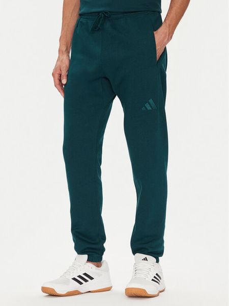 Adidas Spodnie dresowe ALL SZN Fleece JX5096 Zielony Tapered Leg. Zielone spodnie sportowe męskie Adidas, m, bez wzorów, z bawełny. Za 179.99 zł.