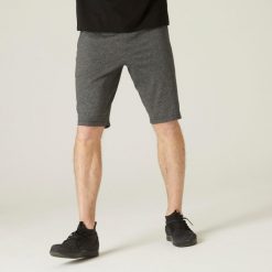 Spodenki fitness męskie Nyamba 500. Czarne buty sportowe męskie DOMYOS, bez wzorów, z materiału, bez zapięcia, na fitness i siłownię. Za 69.99 zł.