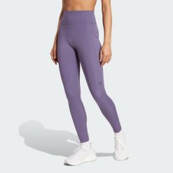 Legginsy Own the Run 7/8. Fioletowe legginsy damskie Adidas, bez wzorów, z materiału. W wyprzedaży za 217.62 zł.