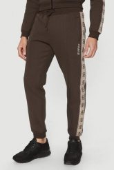 GUESS Brązowe męskie spodnie dresowe z lampasami Mickey, Rozmiar S. Brązowe spodnie sportowe męskie Guess, l, z aplikacjami, z dresówki. W wyprzedaży za 355.99 zł.
