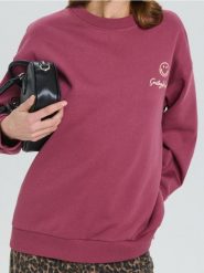 Bluza z nadrukiem na plecach SmileyWorld® - czerwony. Czerwone bluzy damskie Sinsay, l, bez wzorów, bez ramiączek, bez kaptura. W wyprzedaży za 27.99 zł.