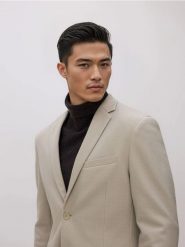 Marynarka slim fit - beżowy. Brązowe garnitury męskie Reserved, l, bez wzorów, z dzianiny. Za 259.99 zł.