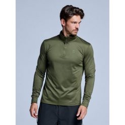 Bluza narciarska - Męska - Arctic 2.0 - Olive Green. Zielone bluzy męskie POEDERBAAS, na zimę, m, bez wzorów, z elastanu, sportowe, bez ramiączek, bez kaptura. W wyprzedaży za 177.72 zł.