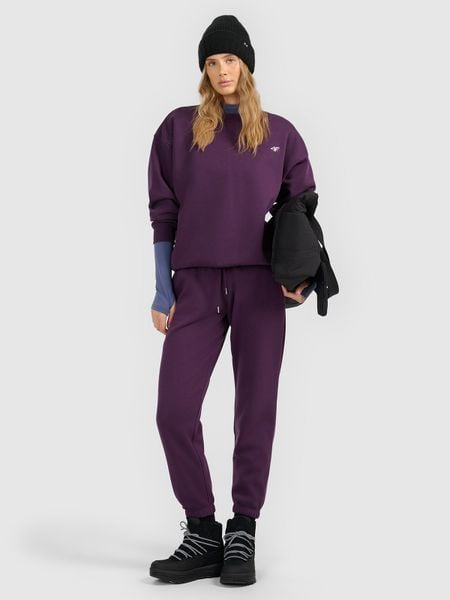 4F Spodnie dresowe joggery damskie - fioletowe M. Fioletowe spodnie dresowe damskie 4F, bez wzorów, z dresówki, sportowe, z podwyższonym stanem, długie. Za 129.99 zł.