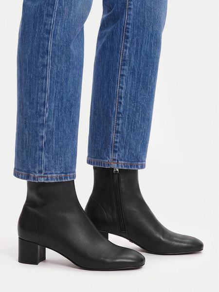 GINO ROSSI Botki C-TS6317-01 Czarny. Czarne botki damskie Gino Rossi, bez wzorów, ze skóry, bez obcasa, na słupku, bez zapięcia. Za 349.99 zł.