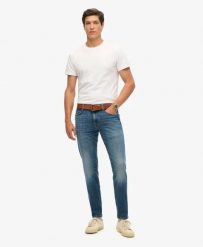 Superdry Denimowe Jeansy Slim Vintage z Bawełny Organicznej. Niebieskie jeansy damskie Superdry, z aplikacjami, z bawełny, eleganckie. Za 440.85 zł.