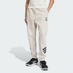 Spodnie Dresowe Adidas Star Wars The Mandalorian. Brązowe spodnie sportowe męskie Adidas, s, bez wzorów, z dresówki, na fitness i siłownię. W wyprzedaży za 209.40 zł.