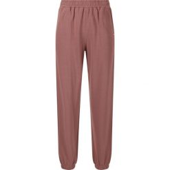 Damskie spodnie dresowe Athlecia Carmen. Brązowe spodnie dresowe damskie Athlecia, bez wzorów, z dresówki, sportowe, na fitness i siłownię. Za 182.50 zł.