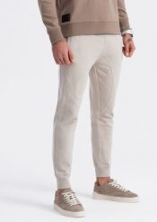 Ombre Spodnie męskie dresowe typu jogger - jasnobeżowe V1 OM-PABS-0173 XXL. Brązowe spodnie sportowe męskie Ombre, m, bez wzorów, z dresówki. Za 89.99 zł.