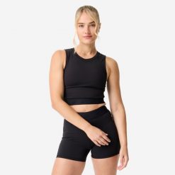 Koszulka fitness damska Domyos crop top. Czarne koszulki sportowe damskie DOMYOS, l, bez wzorów, z elastanu, bez ramiączek, na fitness i siłownię. Za 69.99 zł.