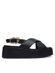 LOVE MOSCHINO Sandały JA16137I0OIA0000 Czarny. Czarne sandały damskie Love Moschino, bez wzorów, ze skóry, bez obcasa, na koturnie, bez zapięcia. Za 929.99 zł.