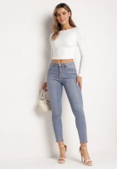 Jasnoniebieskie Jeansy Skinny z Bawełny Ozdobione Złotą Farbą Taidda. Niebieskie jeansy damskie Born2be, z aplikacjami, z bawełny, eleganckie. Za 129.99 zł.
