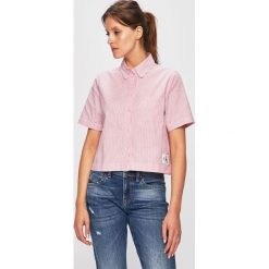 Calvin Klein Jeans - Bluzka. Czerwone bluzki damskie Calvin Klein Jeans, l, bez wzorów, z bawełny, bez kołnierzyka, bez ramiączek. W wyprzedaży za 199.90 zł.
