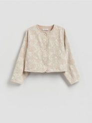 Jeansowa marynarka - złamana biel. Marynarki i żakiety damskie Reserved, bez wzorów, z bawełny, bez kołnierzyka, bez ramiączek. Za 159.99 zł.